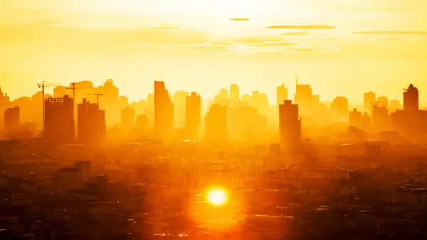 View of buildings in Bangkok business district through extremely orange sunlight